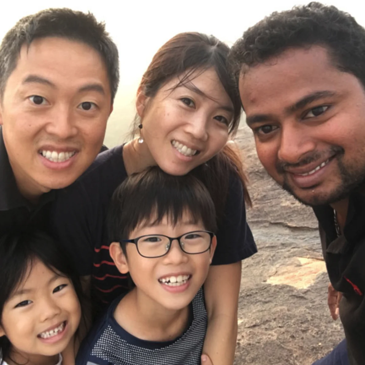 Family taking a selfie with their Sri Lankan private driver during a sightseeing day