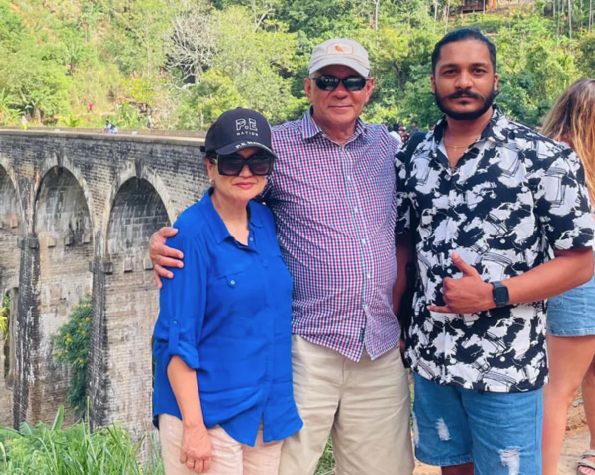 Travellers and their Sri Lankan private driver near the Nine Arch Bridge