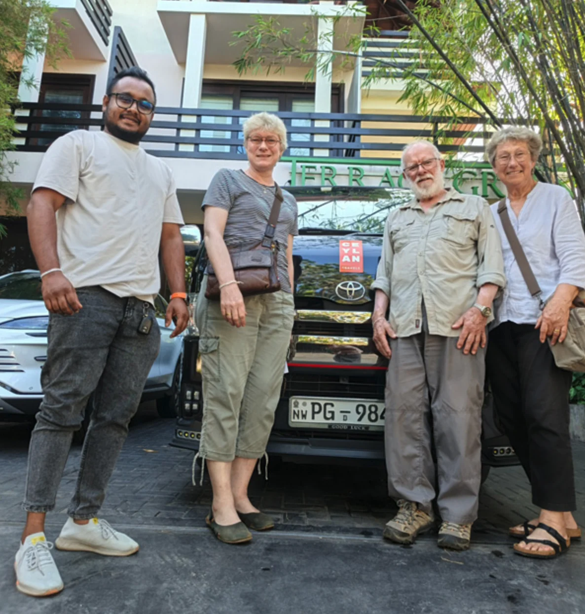 Mature travelers with their private driver and tour van in Sri Lanka