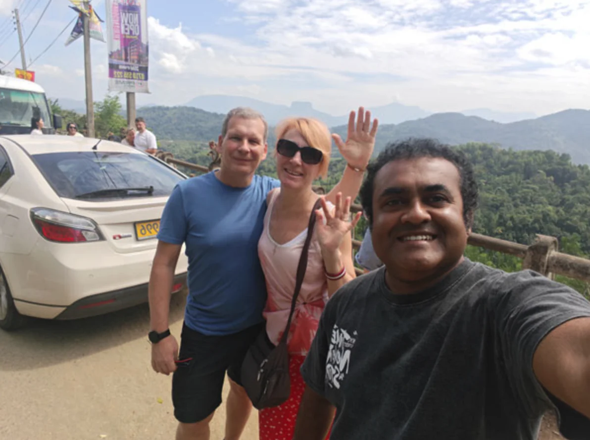 Couple travelling through Sri Lanka's hill country with their driver