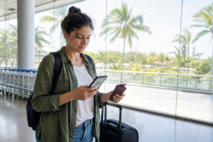 Traveller at a Sri Lankan airport holding a passport and ETA confirmation